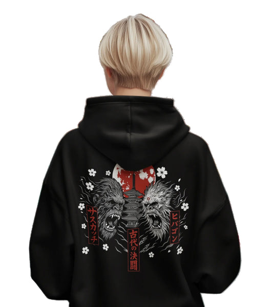 Model wearing the black Bigfoot vs Hibagon graphic hoodie by Weirdo 4 Life