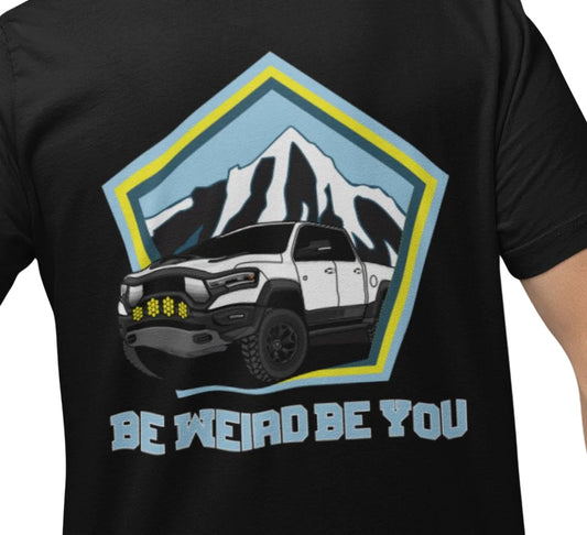 Close-up of off-road truck and mountain-inspired artwork on a Weirdo 4 Life T-shirt